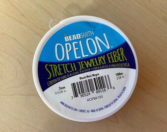 Opelon 0.7mm Black Stretch Jewelry Fiber, 100 meter Spool
