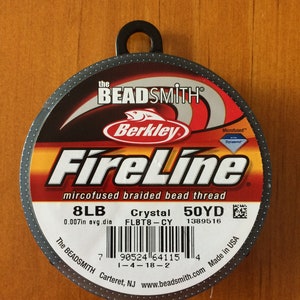 May include: A spool of black FireLine microfused braided bead thread by Berkley Beadsmith. The spool is labeled 8LB, 0.007in avg. dia, Crystal FLBT8-CY, 50YD, 1389516. The barcode is 7 90524 64115 4 1-4-18-2. The spool is made in the USA.