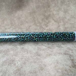 8-506, Higher Metallic June Bug, 8/0 Seed Bead by Toho