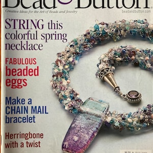 May include: Bead & Button magazine cover featuring a colorful beaded necklace with a purple and blue glass pendant. The magazine cover text reads "STRING this colorful spring necklace".
