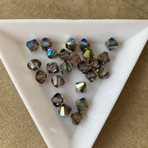 Swarovski 6mm Bicone, Crystal Iridescent Green, package of 24, Article 5328 / 5301