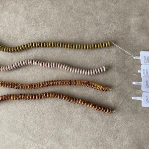 Czech 2 Hole Lentil, 6x2.4mm, 50 bead strand, Browns & Neutrals