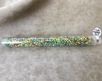 May include: A clear plastic tube filled with small, colorful glass beads. The beads are a mix of brown, green, and blue. The tube has a white label that says "Tidal Marsh Mix".