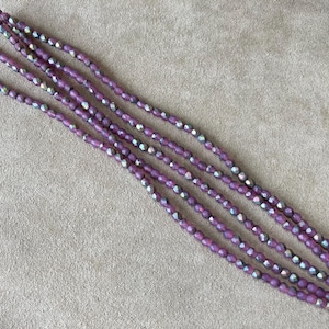 2er Set, 3 mm Czech Fire Polish, Matte Purple AB, 50 Stck./Strang