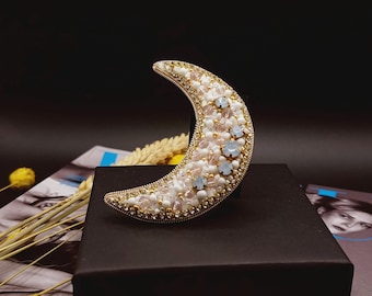 Crescent moon brooch