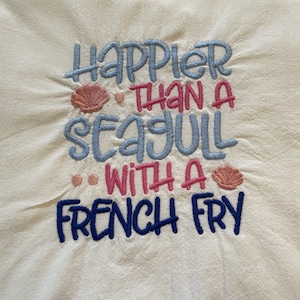 Beach themed embroidered flour sack tea towel, happier than a seagull with a french fry