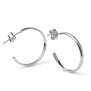 May include: A pair of silver-toned hoop earrings with a smooth, polished finish. Each earring features a circular open design with a standard post and butterfly clutch backing mechanism for secure attachment to the earlobe.