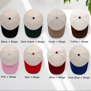 May include: A collection of eight baseball caps with beige crowns and colored brims. The color combinations include black, dark green, khaki, coffee, pink, red, wine, and dark blue. Each cap has a matching colored button on top. The text on the image reads "Black + Beige", "Dark Green + Beige", "Khaki + Beige", "Coffee + Beige", "Pink + Beige", "Red + Beige", "Wine + Beige", and "Dark Blue + Beige".