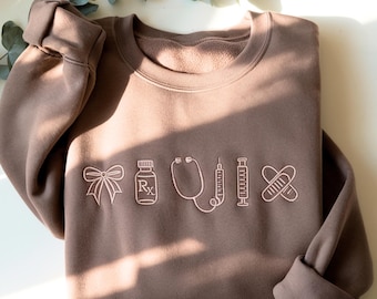 Embroidered Nurse sweatshirt, Coquette Bow, Personalized CNA Crewneck - Nursing Student Sweatshirt For Her