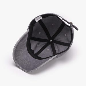 May include: A gray baseball cap with a curved brim, viewed from the inside. The cap has a distressed look, with a black interior and a strap for adjustment. The cap is made of a soft material.
