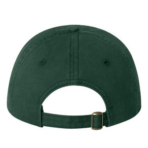 May include: A dark green baseball cap with an adjustable strap and buckle closure.