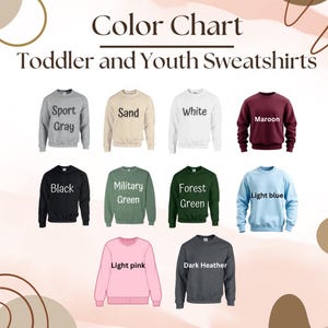 May include: Color chart for toddler and youth sweatshirts in various colors, including sport gray, sand, white, maroon, black, military green, forest green, light blue, light pink, and dark heather.