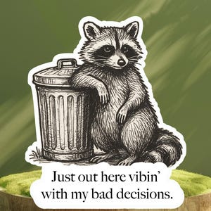May include: A black and white illustration of a raccoon leaning against a trash can. The text on the sticker reads, "Just out here vibin' with my bad decisions."