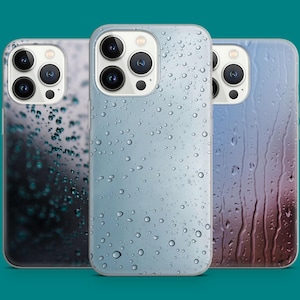 May include: Three smartphone cases with water droplet designs. The cases feature a variety of colors, including blue, gray, and purple. The cases have a glossy finish and are designed to protect the phone.