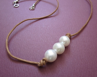 triple freshwater pearl necklace on natural beige leather cord with sterling spring ring clasp