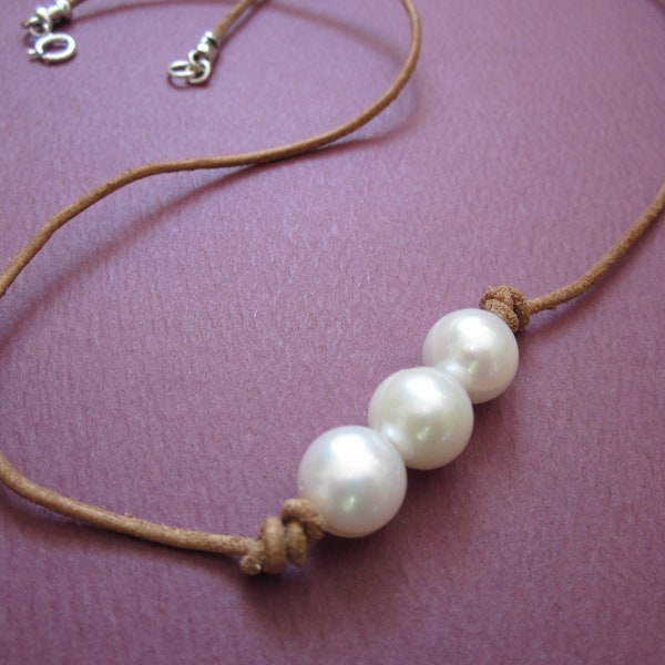 triple freshwater pearl necklace on natural beige leather cord with sterling spring ring clasp