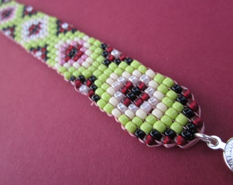 square stitch seed bead bracelet in green, red, pink and black