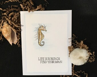 Beach Theme Quote Greeting Card with Seahorse and Quote “ Life is a Beach, Find your Wave”