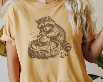 Pottery T-Shirt Ceramic Artist Shirt Potter Gift Tee Cute Raccoon at the Pottery Wheel Throwing Shirt Animal Pottery Shirt