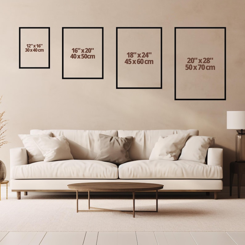 May include: Four framed art prints of varying sizes, 12" x 16", 16" x 20", 18" x 24", and 20" x 28", with black frames and beige backgrounds. The prints are displayed above a white sofa and a wooden coffee table, creating a modern living room aesthetic.