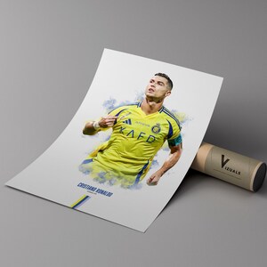 poster mockup leaning on a branded cardboard tube. poster of soccer player cristiano ronaldo celebrating for Al Nassr.