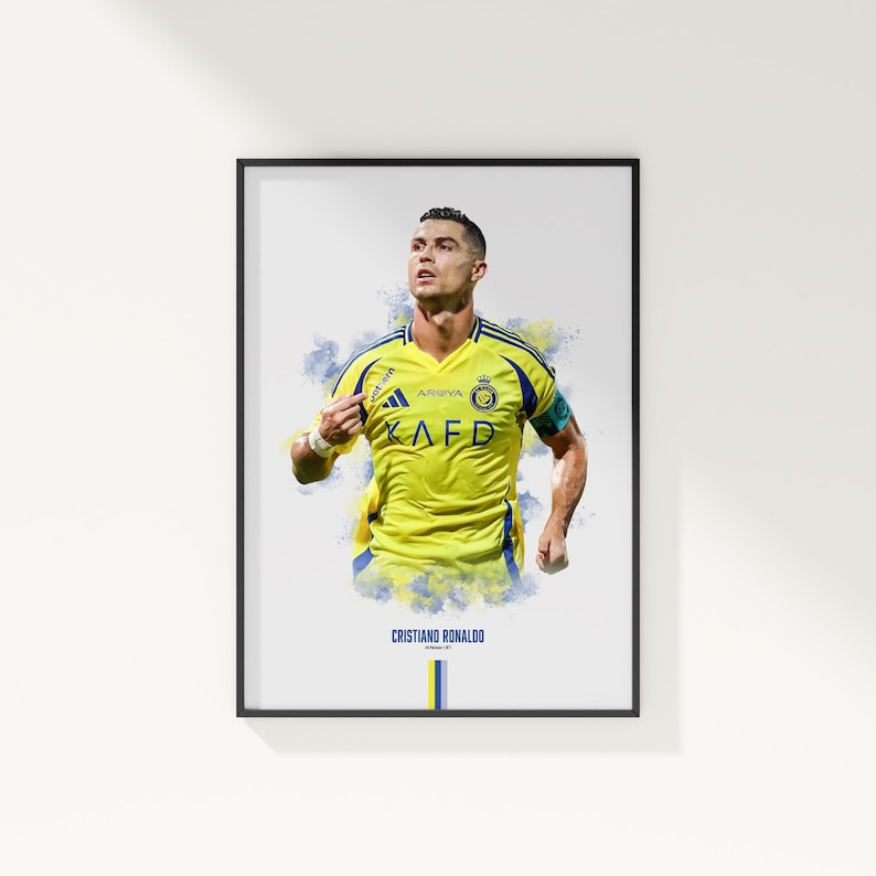 framed poster mockup hanging on a white wall. poster of soccer player cristiano ronaldo celebrating for Al Nassr.