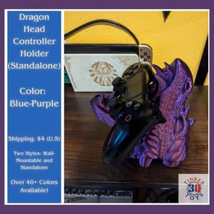 May include: A purple dragon head controller holder, designed to hold a video game controller. The holder is a standalone piece and can be used to display a controller on a desk or shelf. The dragon head is detailed and has a textured surface. The controller is not included.