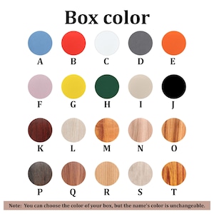 May include: A colour chart titled Box color displaying twenty circular swatches labelled A through T, featuring solid colours like blue, red, white, grey, orange, pink, yellow, green, beige, and black, alongside various wood grain patterns and textures.