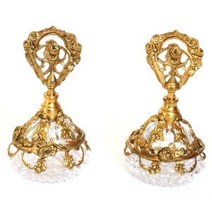 Pair of Vintage Glass Perfume Bottles with Ornate Gold Tone Metal Filigree Overlay with Floral Motif & Glass Daubers