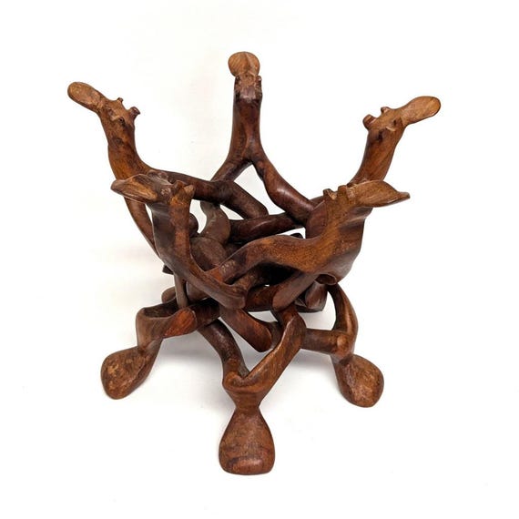 Large Carved Wooden Interlocking Puzzle Stand With Camel Heads for