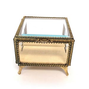 Vintage Beveled Glass Box with Ornate Gold Tone Metal Edges, Raised Feet, Hinged Lid, & Yellow Fabric Lined Interior