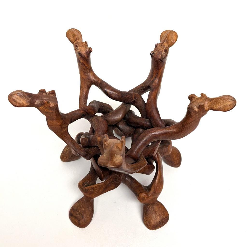 Large Carved Wooden Interlocking Puzzle Stand With Camel Heads for