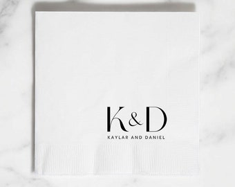 May include: White paper napkin with black text that reads "K&D Kaylar and Daniel".