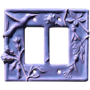 May include: A purple ceramic double light switch cover with a hummingbird and floral design.