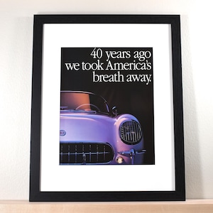 May include: A black and white framed print of a vintage car with the text "40 years ago we took America's breath away."