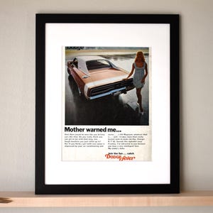 May include: A vintage Dodge Charger advertisement featuring a brown and white car with a woman standing next to it. The text reads "Mother warned me..." and "Join the fun...catch Dodge Fever."