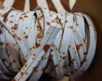 Caramel Splatter Leather Trim: 1/4&quot; White Cowhide Lacing, 30 ft