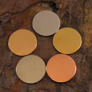 May include: Five round metal discs in different colors: silver, gold, copper, light brown, and dark brown.