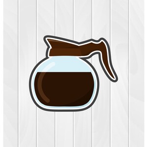 May include: A brown glass coffee pot with a black handle and lid, filled with coffee.