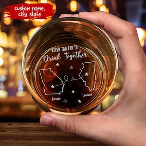 May include: A clear glass with a design of two states connected by a dotted line. The text "Never too far to drink together" is engraved on the glass. The states are labeled "Richard" and "Leonard".