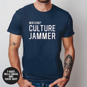 May include: A navy blue t-shirt with white text that reads "NEXTLEVEL® CULTURE JAMMER".