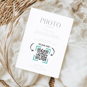 May include: A white card with the words "PHOTO SHARING" at the top. Below are instructions and a QR code with the text "SCAN ME!" in teal. The card is for sharing photos to an album. The names Elizabeth & Anthony and the date 12.6.27 are at the bottom.