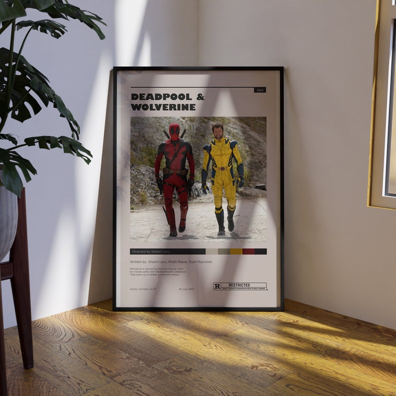 K&ouml;nnte beinhalten: Ein Filmplakat f&uuml;r Deadpool & Wolverine, mit Deadpool in einem rot-schwarzen Anzug und Wolverine in einem gelben Anzug. Das Plakat hat eine rote "R"-Bewertung und den Text "Deadpool & Wolverine" in wei&szlig;er Schrift.