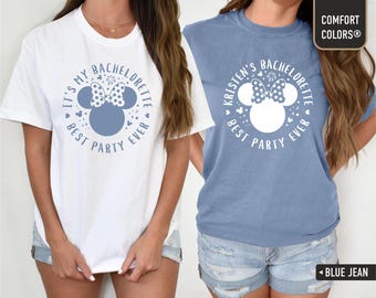 May include: Two white t-shirts with blue and red Mickey Mouse ears and the text "It's My Bachelorette Best Party Ever" and "Kristen's Bachelorette Best Party Ever".