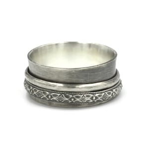 Sterling silver anxiety ring. Wide band silver spinner ring for stress with two rotating rings.