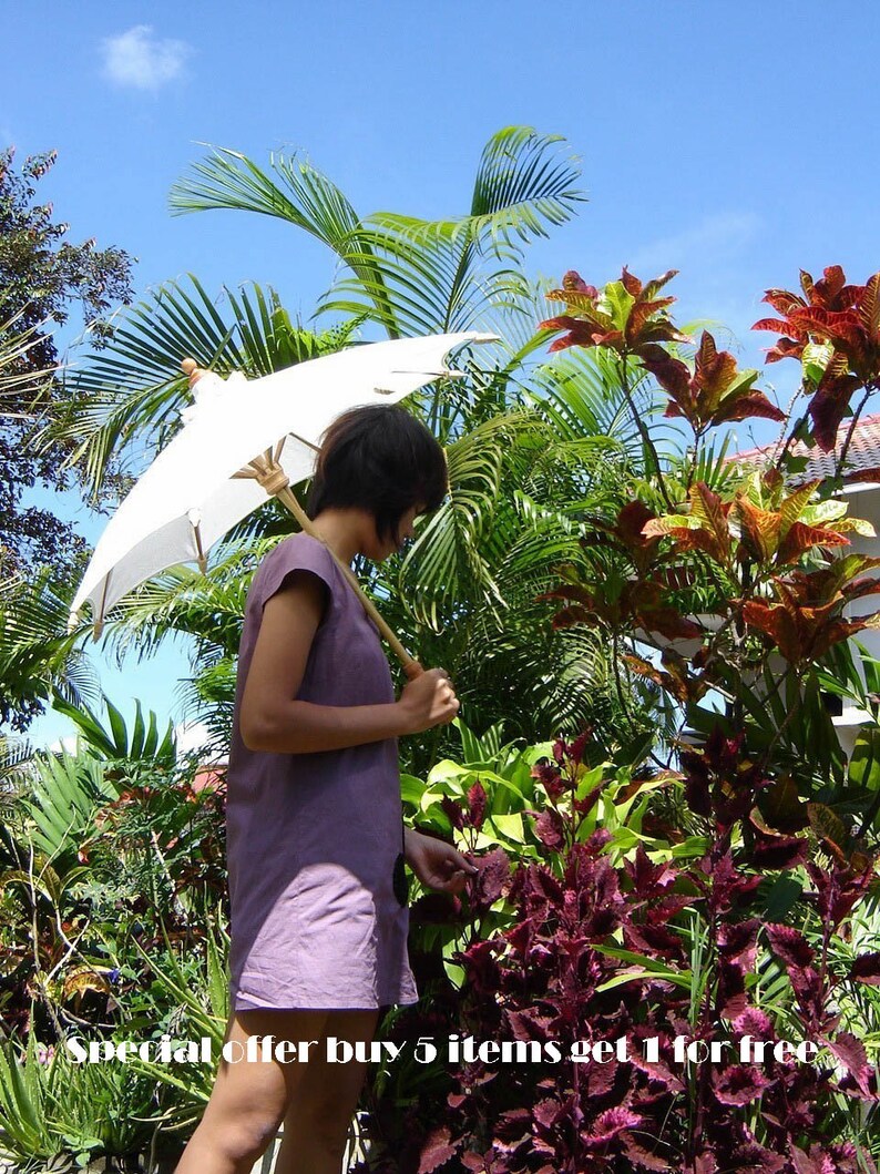 Special offer 5 white parasols get 1 white parasol free image 2