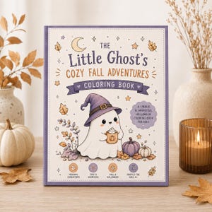 May include: A rectangular coloring book titled The Little Ghost's Cozy Fall Adventures. The cover features a white ghost wearing a purple witch hat, holding a mug, surrounded by pumpkins, leaves, stars, and a crescent moon on a cream background.