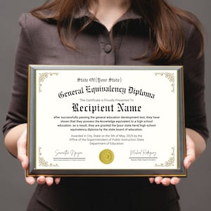 May include: A framed certificate with a gold border and a black background. The text on the certificate reads "State Of [Your State] General Equivalency Diploma This Certificate is Proudly Presented To Recipient Name after successfully passing the general education development test, they have shown that they possess the knowledge equivalent to a high school education, as a result, they are granted the [your state here] high school equivalency diploma by the state board of education. Awarded in City, State on the 5th of May, 2025 by the Office of the Superintendent of Public Instruction State Department of Education".