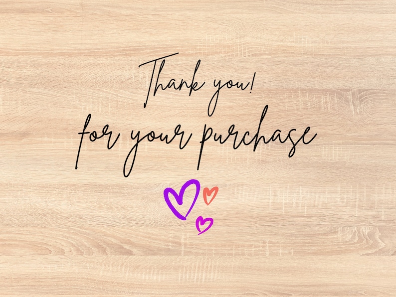 May include: Thank you! for your purchase. The text is written in black cursive font on a light wood background. There are three hearts drawn in the bottom right corner of the image. One heart is purple, and two are pink.