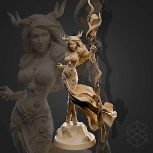 May include: A beige-colored fantasy figurine of a woman with antlers, holding a staff with a crystal. The woman is wearing a flowing gown and standing on a rock base. A ghostly image of the woman is in the background.